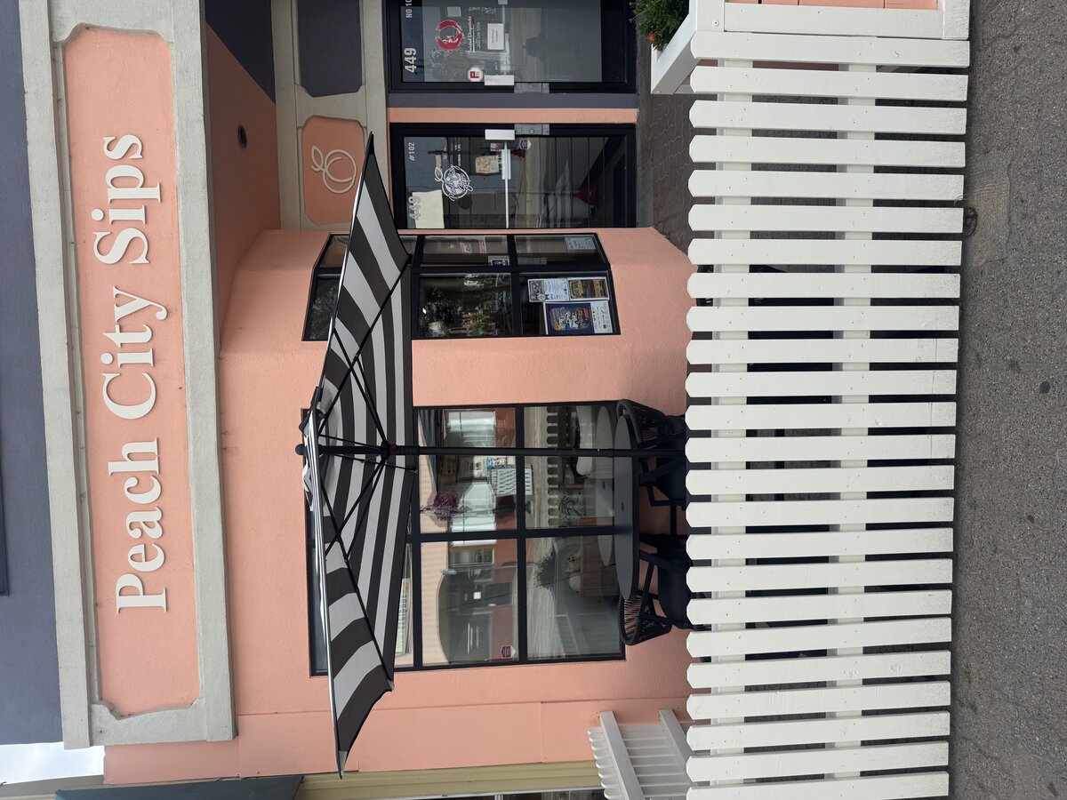 Peach City Sips storefront after Perfect Painting repaint, finished peach exterior with patio