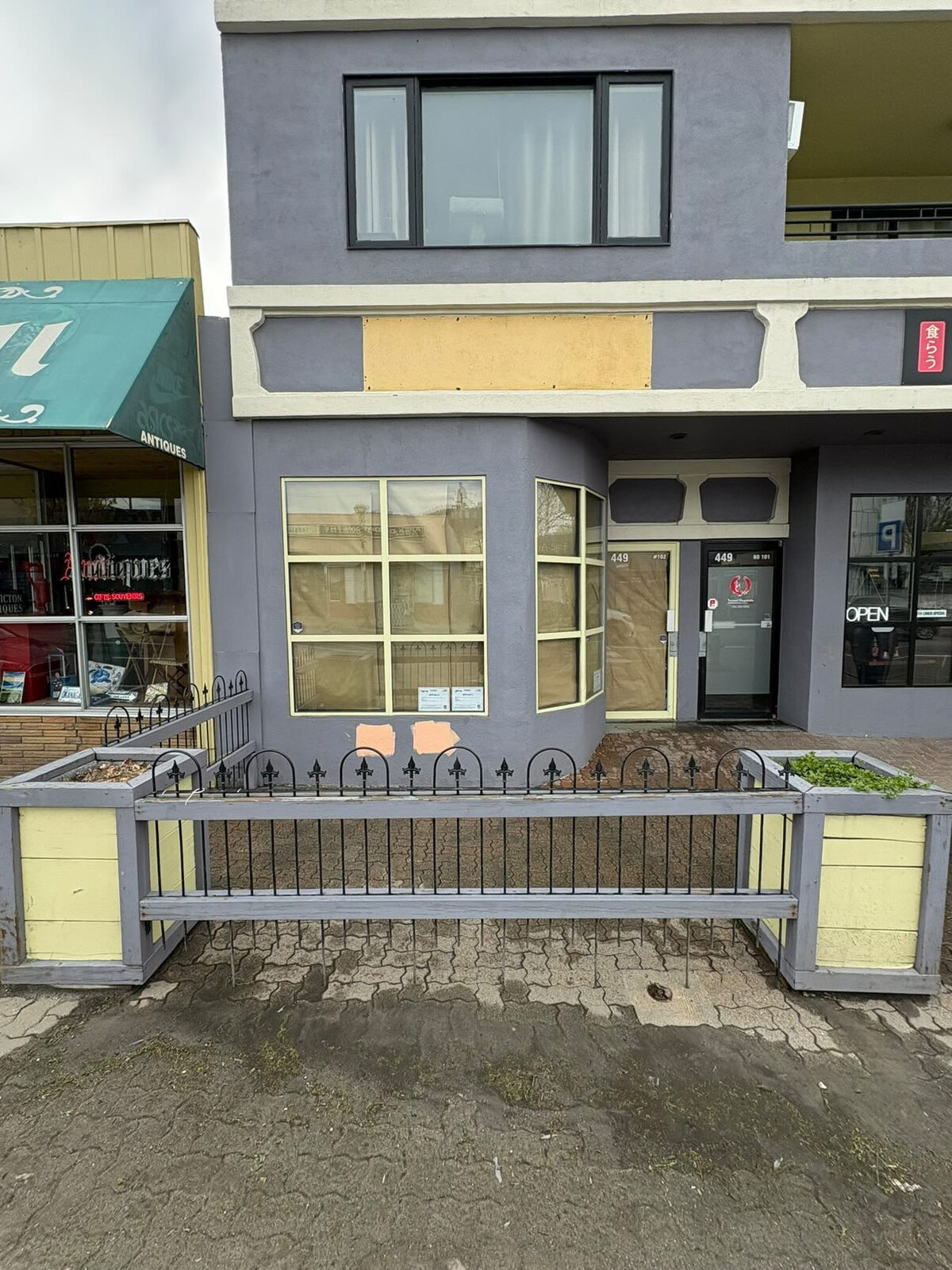 Storefront before repaint, grey exterior